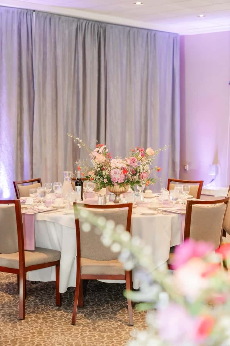 chairs in ballroom around a table