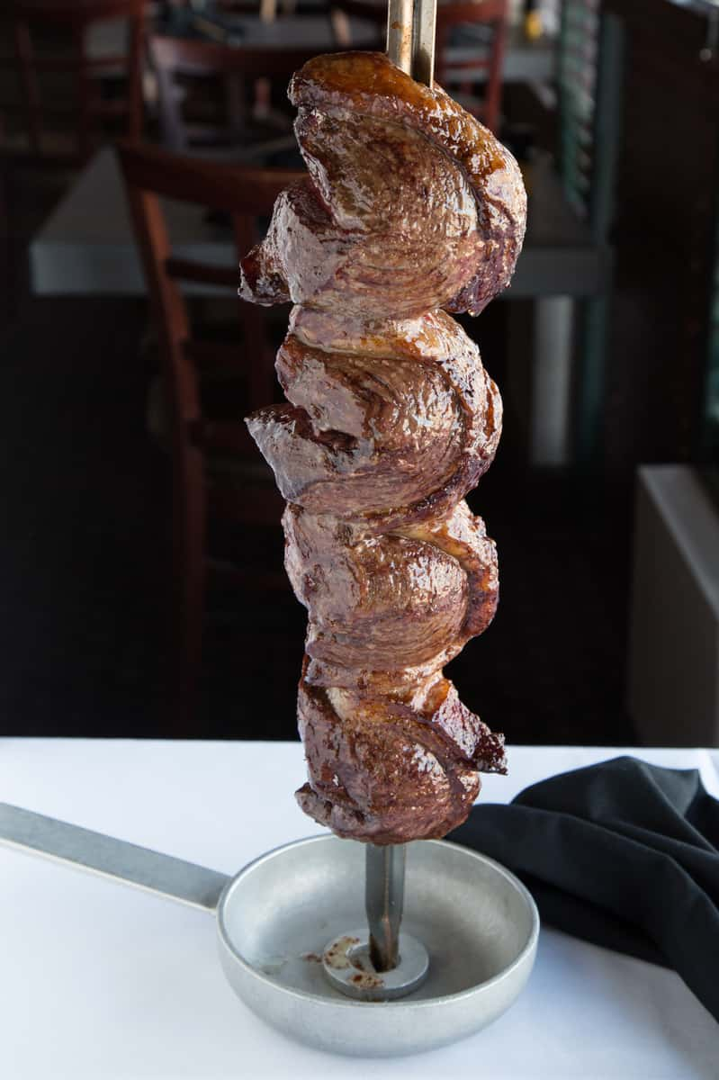 Brazilian steakhouse picanha on the rotisserie (rodizio)