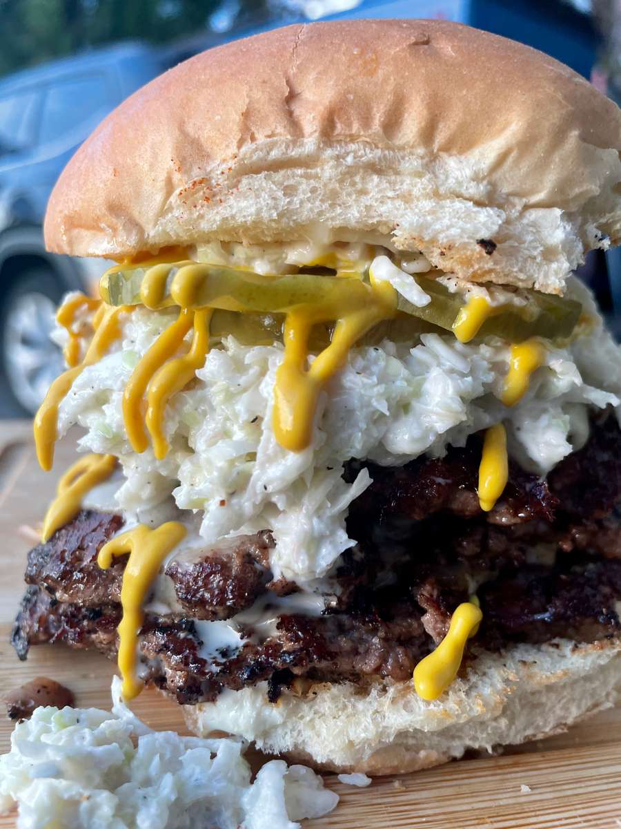 1 1/4 lb patty with cheese, topped with slaw and toppings of your choice