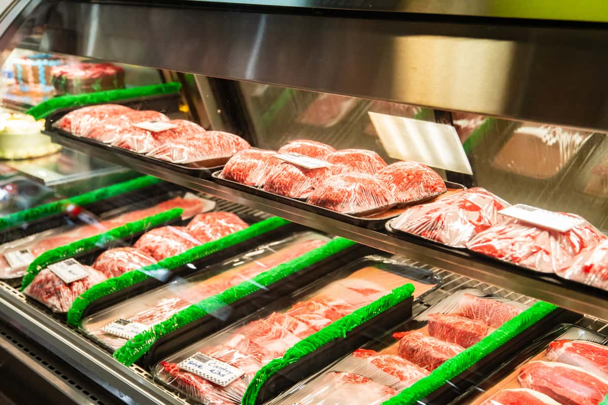 Fresh cuts of meat displayed on trays at The Butcher Shop meat market