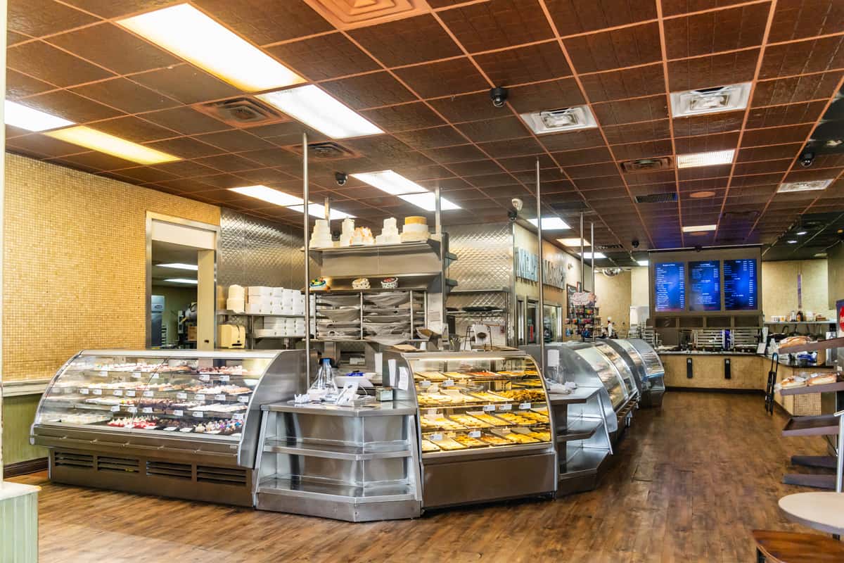 The interior of The Butcher Shop meat market featuring display cases with various meats and prepared foods