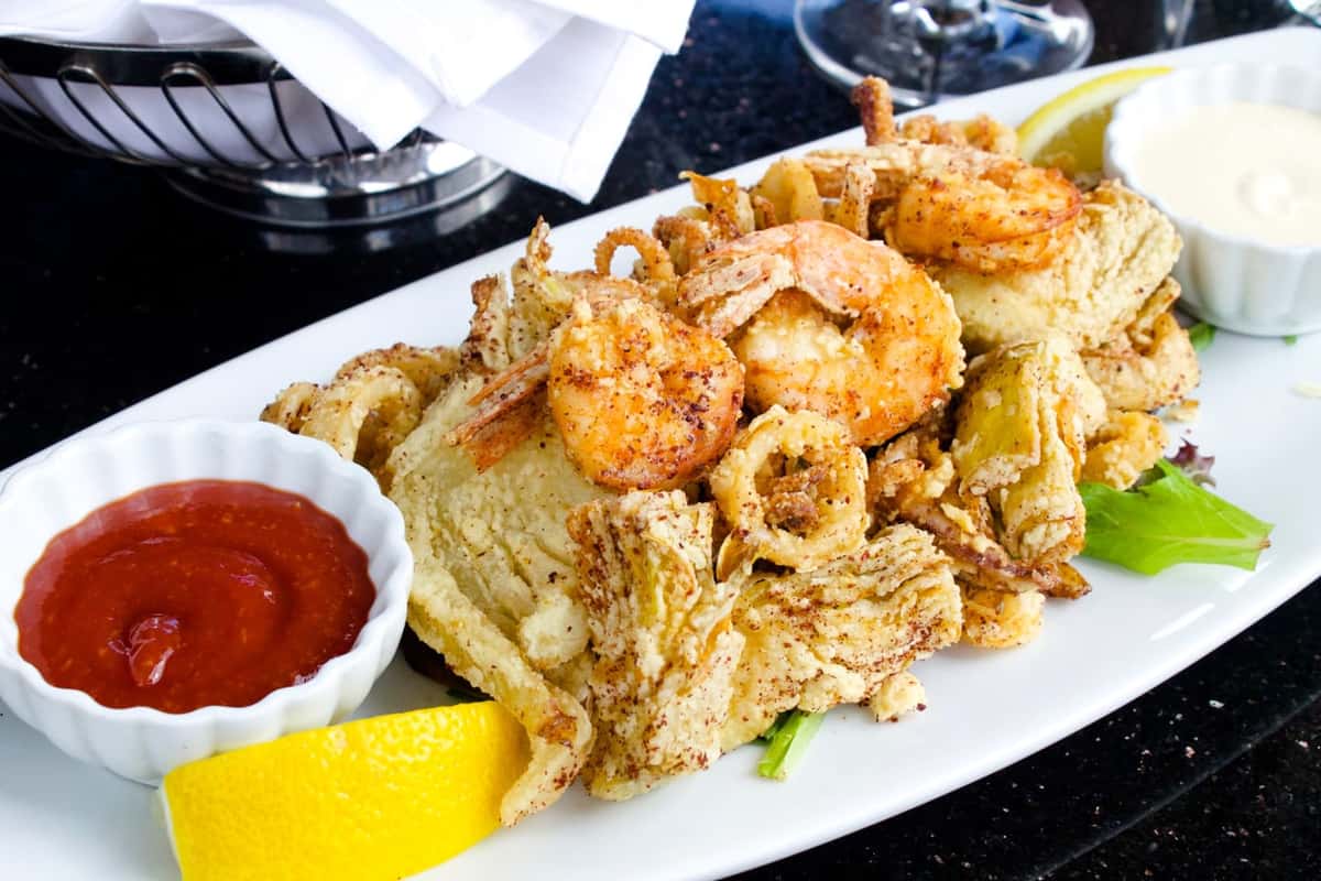 Frito Misto with calamari, shrimp, artichokes and fennel lightly fried. Served with lemon aiolo and cocktail sauce.