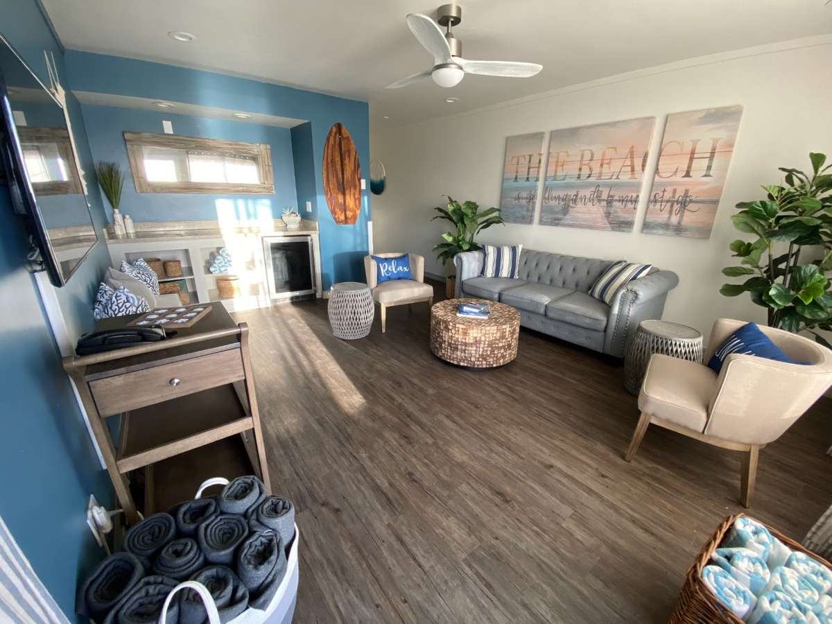 pacific bungalow, couch, furniture, wall art