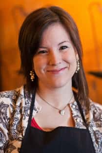 female barista smiling at the camera