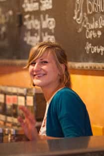 female barista smiling at the camera
