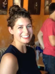 female barista smiling at the camera