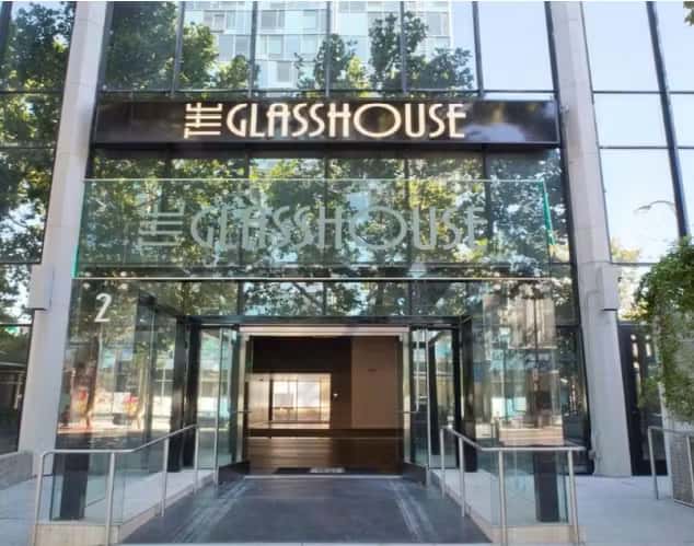 Modern glass-front event venue entrance with elegant architecture and upscale contemporary design
