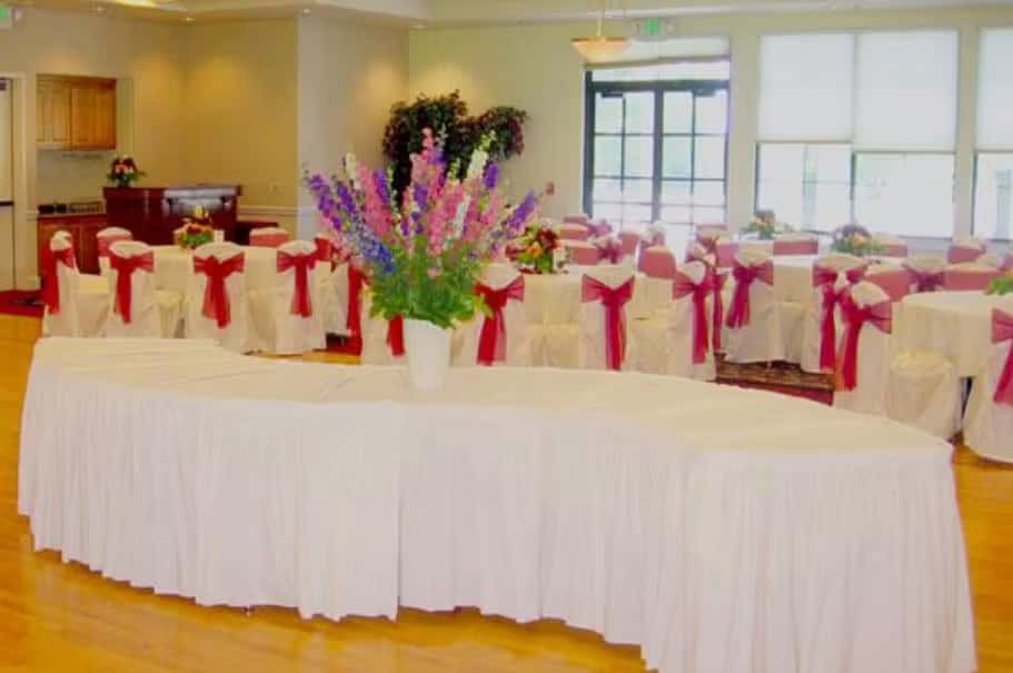 Elegant banquet buffet table with floral centerpieces and upscale event catering presentation