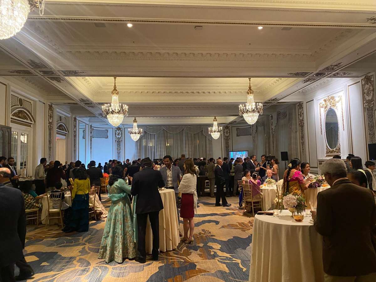 People enjoying an event with food and drinks