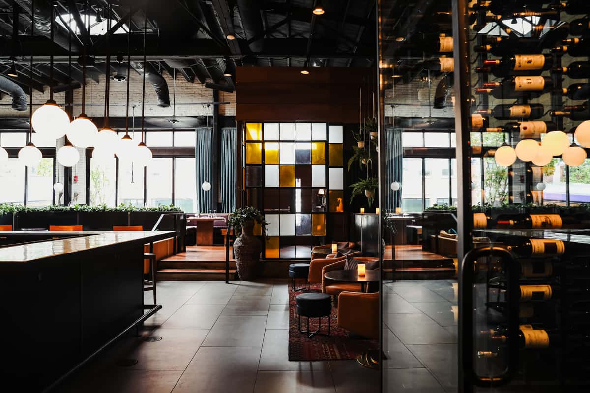 Interior hostess stand with elegant comfortable dining seating options surrounding