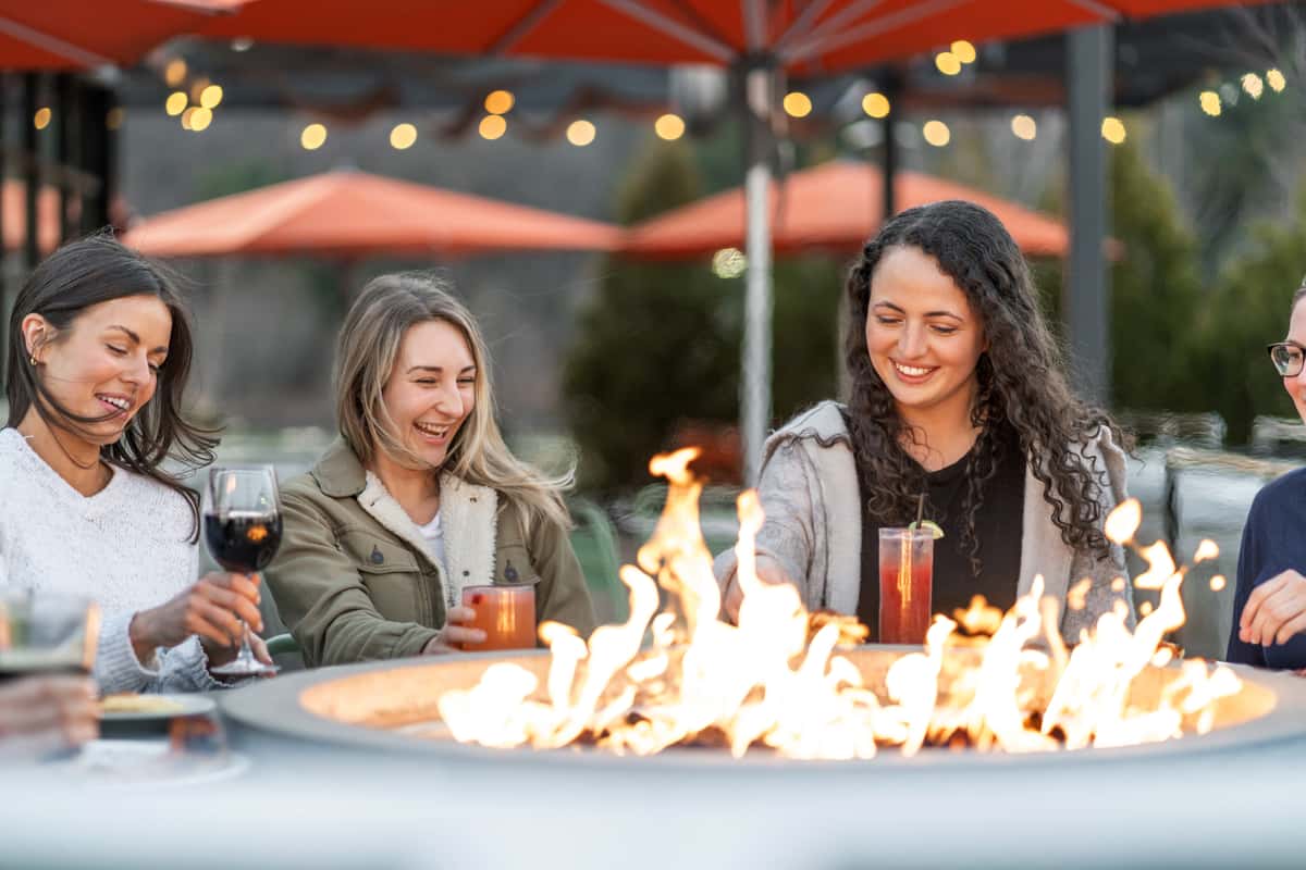 friends dining around fire pit