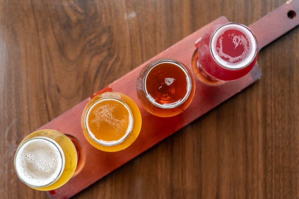 Overhead view of a flight of 4 beers