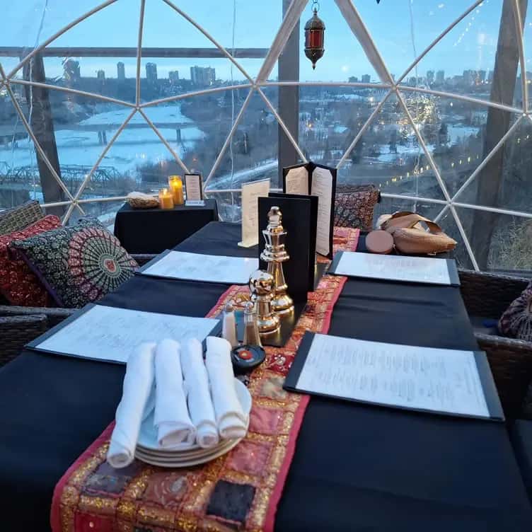 Our outdoor domes, at a River View Bistro, are cozy, heated igloos perched on the patio, offering a unique and intimate dining experience.
