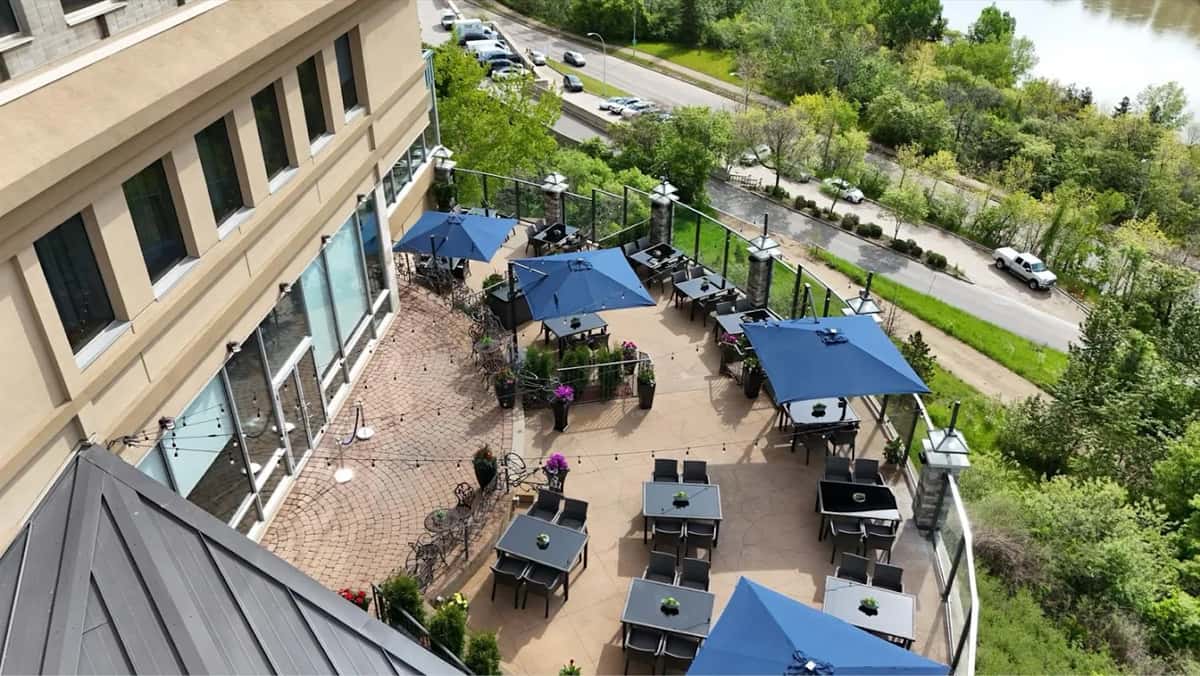 It offers spectacular views of the North Saskatchewan River, creating a peaceful, scenic setting.