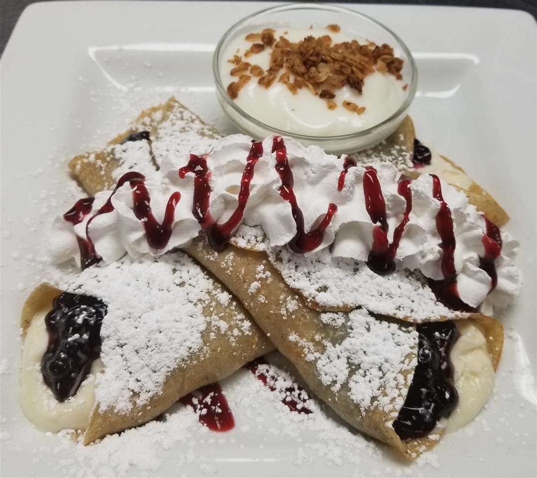 crepes with whipped cream on top