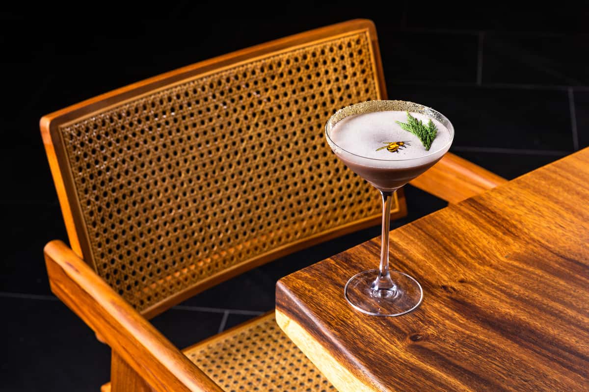 Elegant craft cocktail served in a coupe glass at Kapow! Noodle Bar, showcasing refined mixology, premium ingredients, and a sophisticated Asian fusion dining experience.