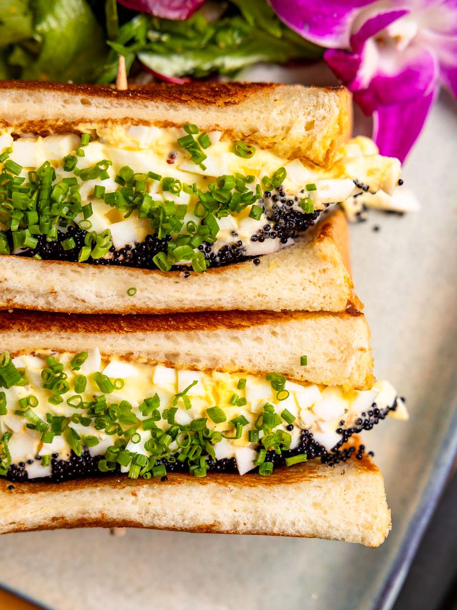 Japanese egg salad sandwich on toasted milk bread at Kapow! Noodle Bar, featuring creamy egg salad and fresh herbs in a modern Asian fusion dining experience in Boca Raton and Delray Beach.