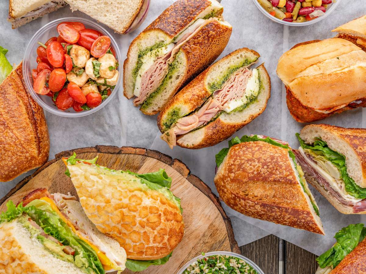 A collection of sandwiches and fruit