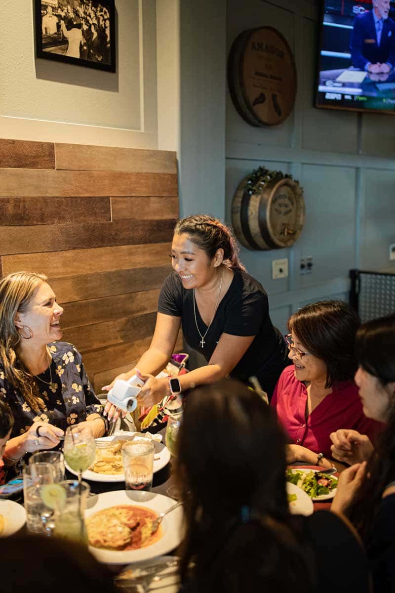 waitress serving guests