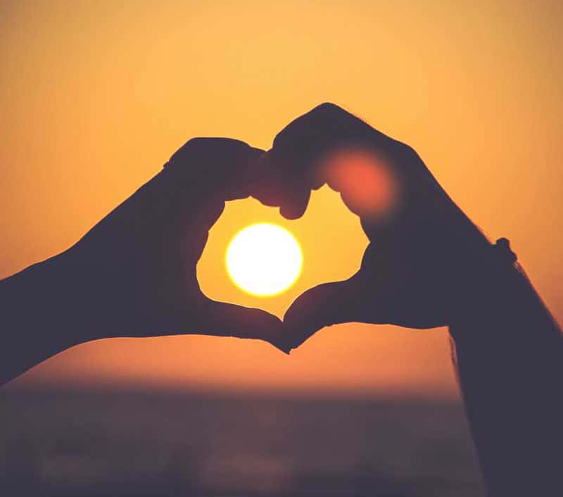 two hands forming the shape of a heart