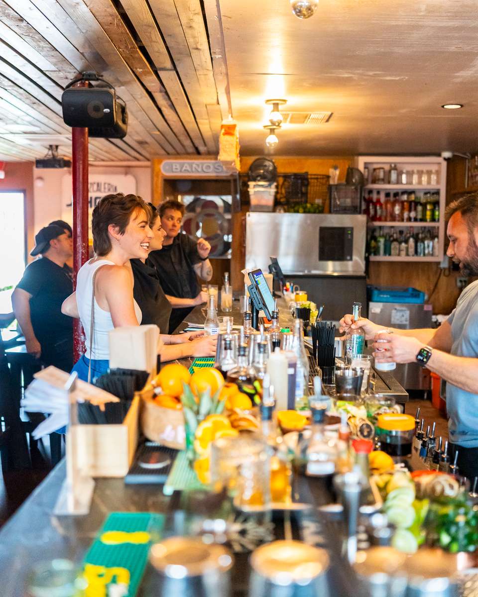 Bartender making a drink for customer