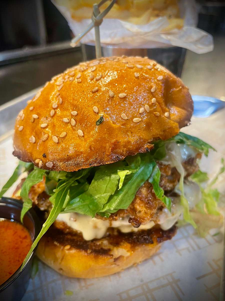 two griddled Louisiana Gator & pork patties, muenster cheese, BBQ Garlic aioli, pickled fresno chilies, caramelized onions, shredded lettuce *Gators live in the water & have diet of fish & other water creatures, this results in a mild fish like flavor. *Order at your own risk, no refunds.