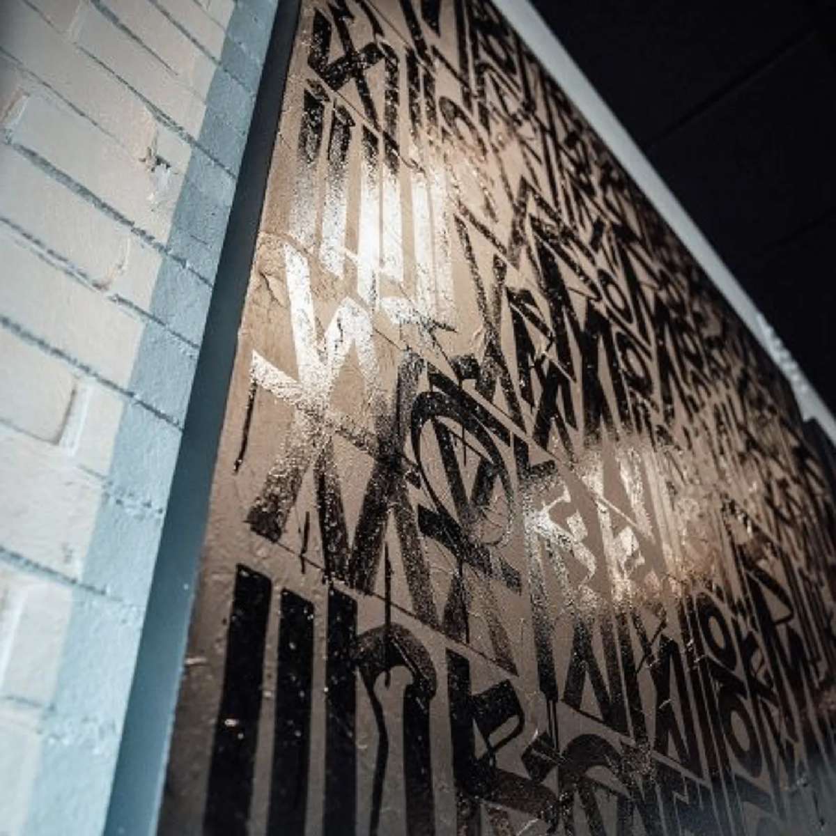 RETNA artwork hanging in Rutledge restaurant