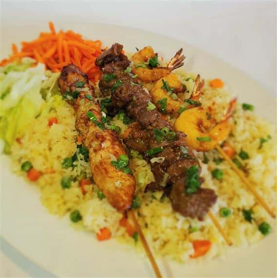 rice with various meats on skewers