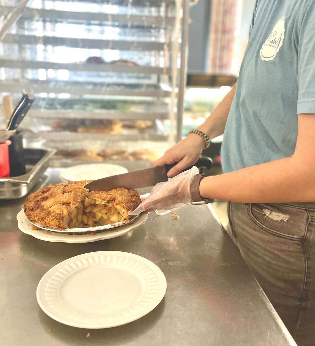 an employee slicing a pie
