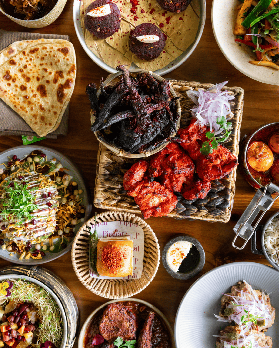 Indian brunch dishes at Pippal Emeryville including small plates, tiffin meals, and regional Indian curries near Bay Street