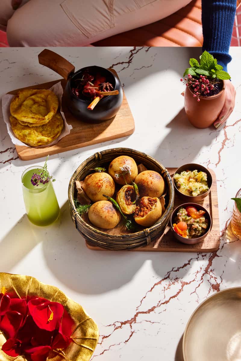 Bites of food on a table with cocktails