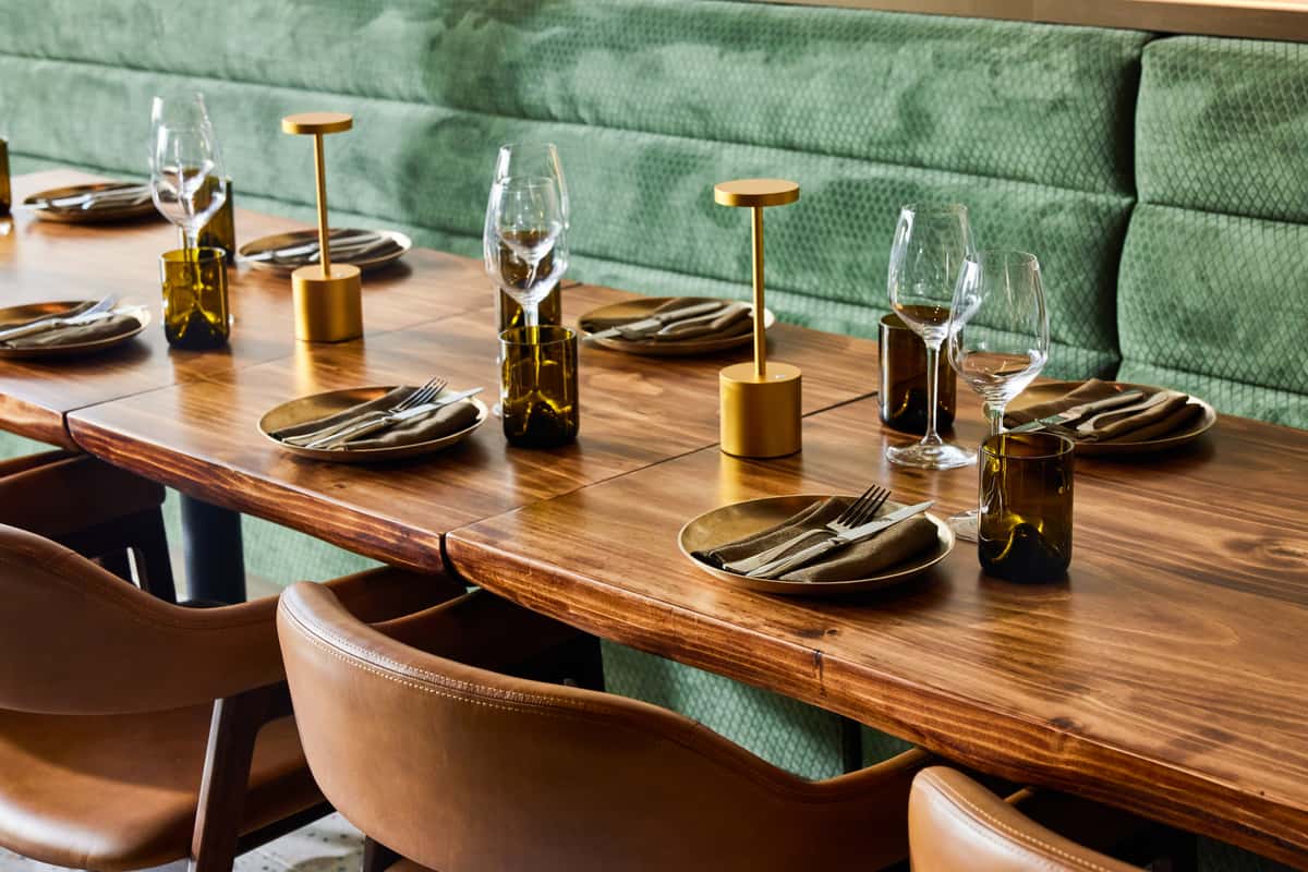 Table settings with plates, napkins, and drinking glasses