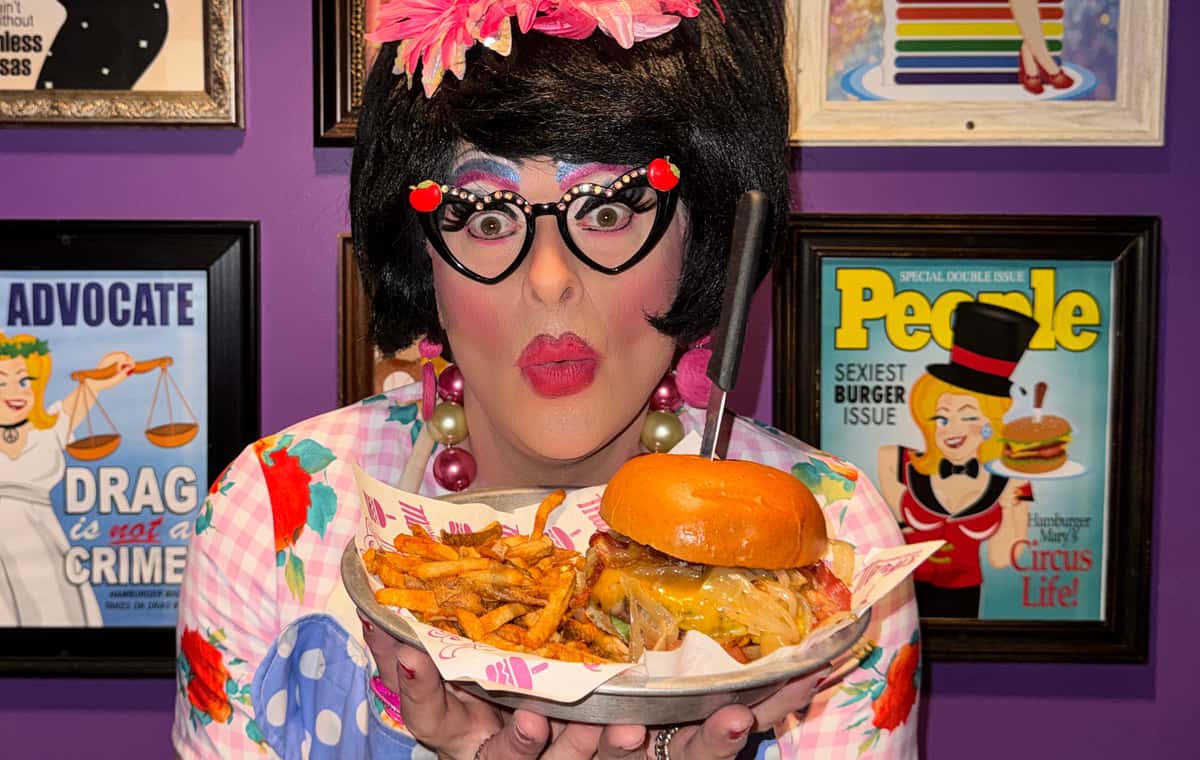 Drag Queen holding a burger
