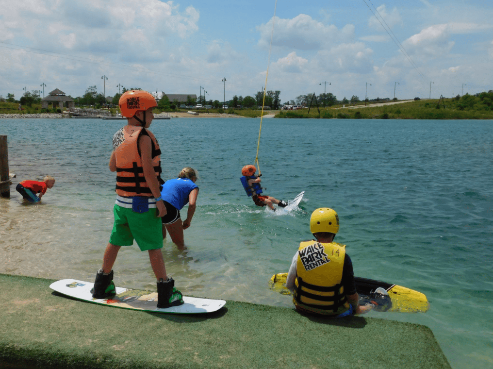 Photo of Children that are Wakeboarding