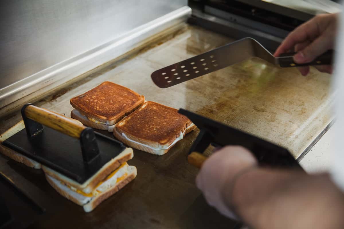 grilled cheese cooking on hot grill