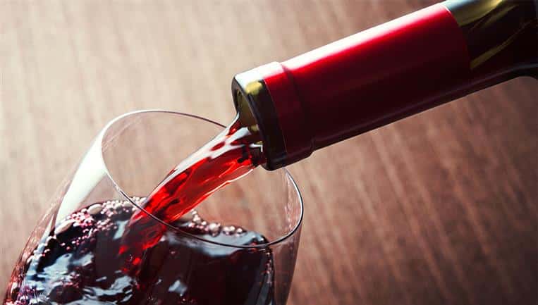 wine being poured into a glass