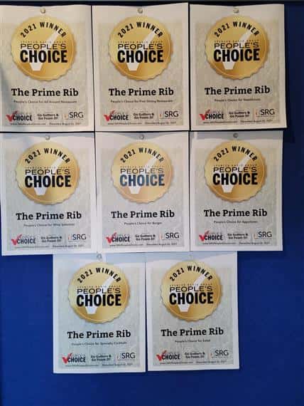 Multiple people's choice awards on a wall