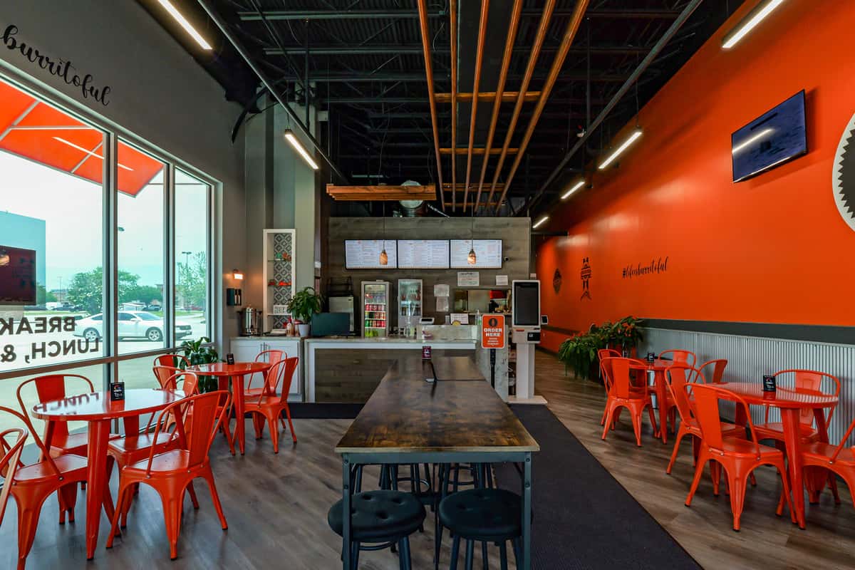 Interior of Señor Burrito Company with chairs and tables