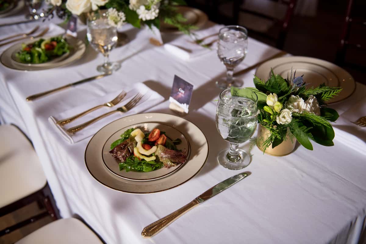 A picture of a wedding table with salad