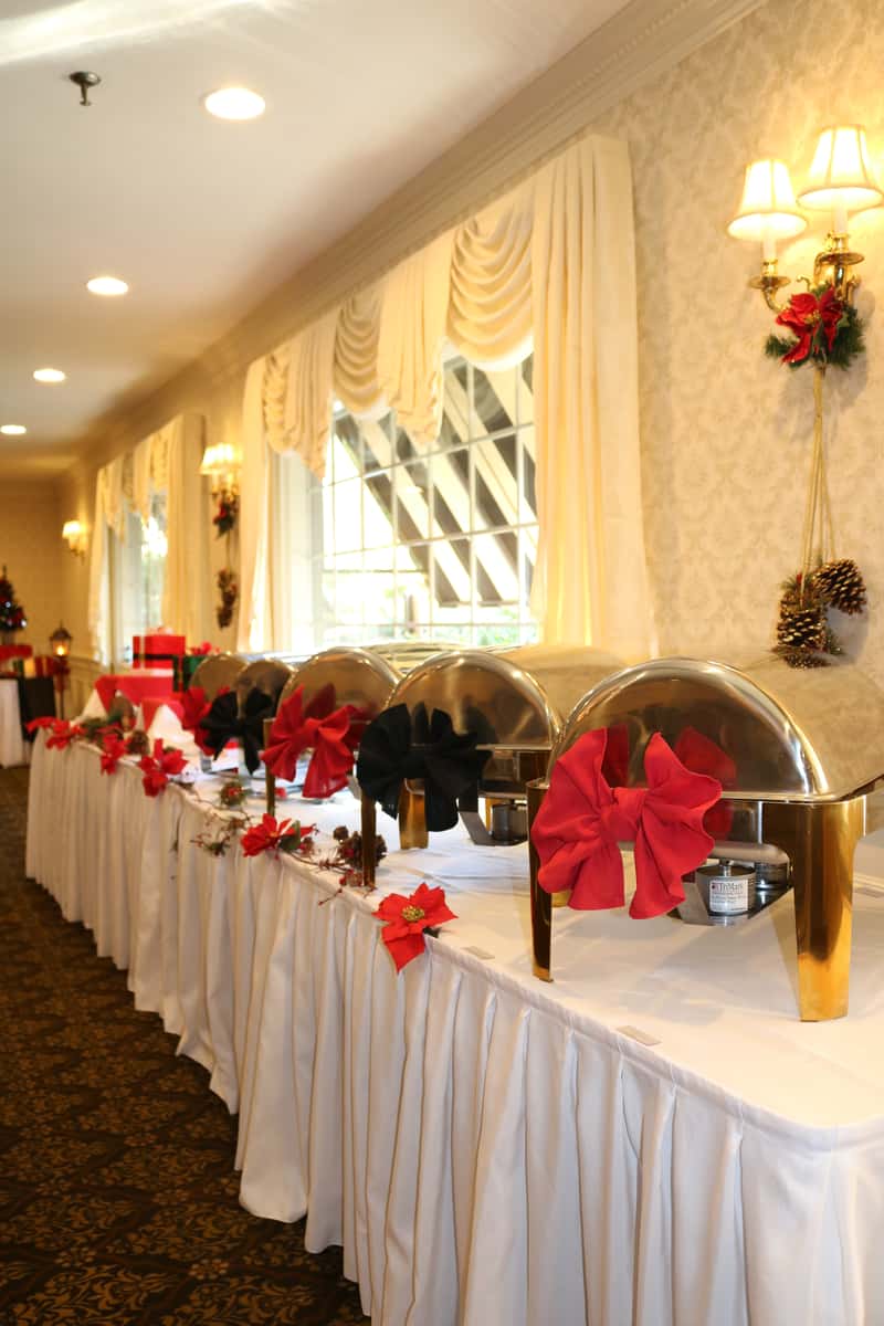 Holiday buffet setup at Brack's Grille & Tap featuring elegant chafing dishes, festive holiday décor, and professional catering for weddings, banquets, and private events.