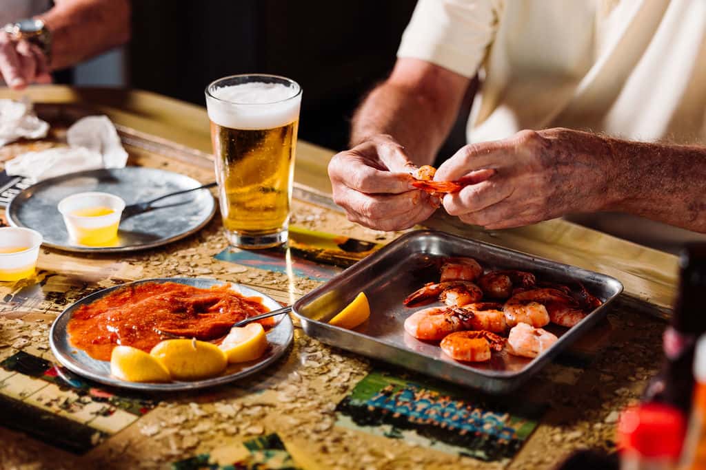 Customer peeling his steamed shrimp