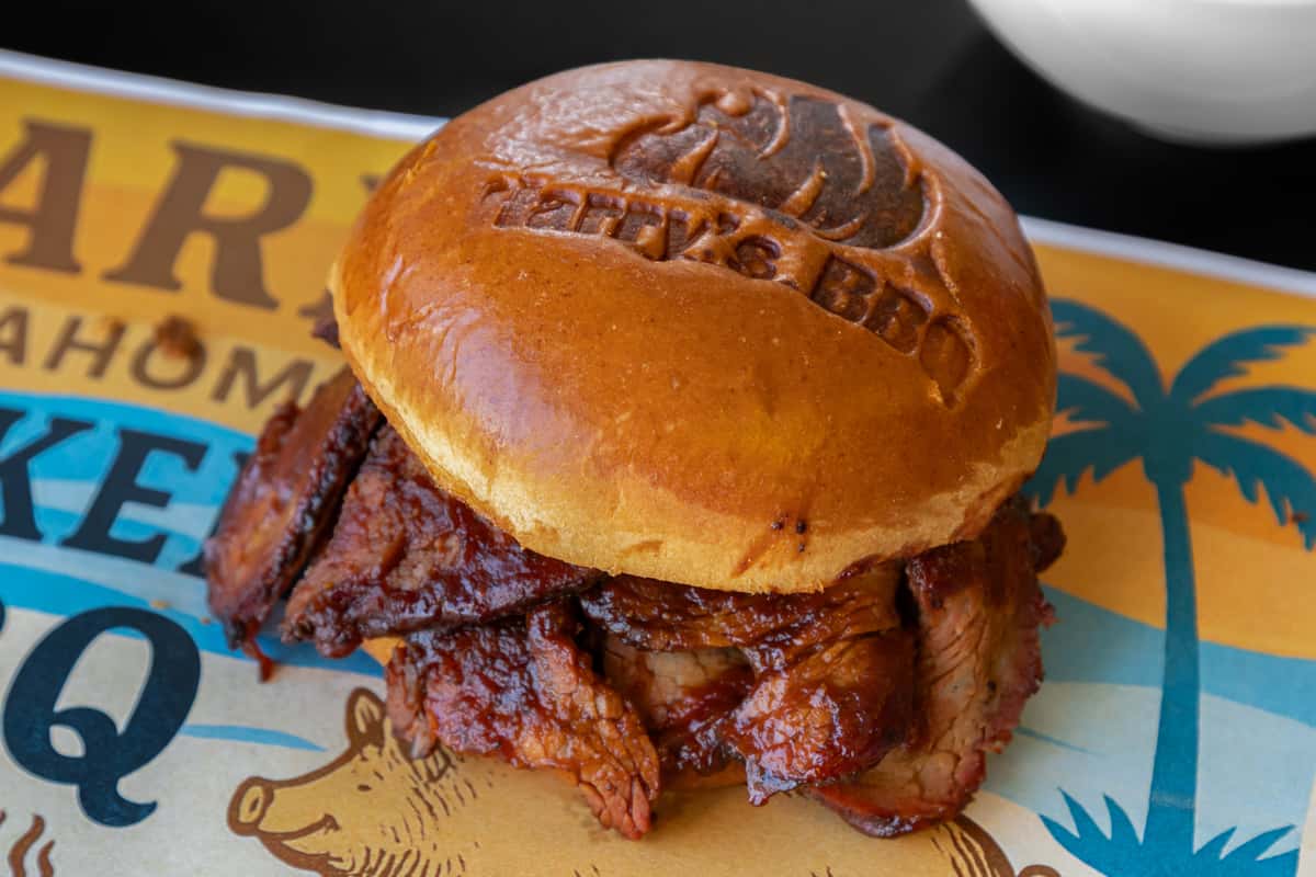 Our smokehouse twist on the classic French dip - thin-sliced, hickory-smoked tri-tip stacked on a fresh roll with melted cheese, served alongside rich au jus for dipping. Juicy, smoky, and bold, it's a hearty sandwich for true BBQ lovers