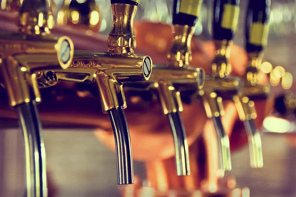 close up of brass beer taps