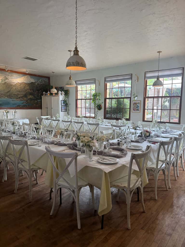 beautiful tables in the Lake Como Room with tablecloths set for an event