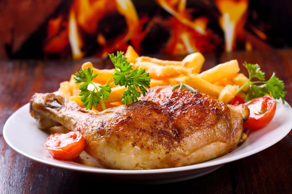 roasted chicken leg with french fries