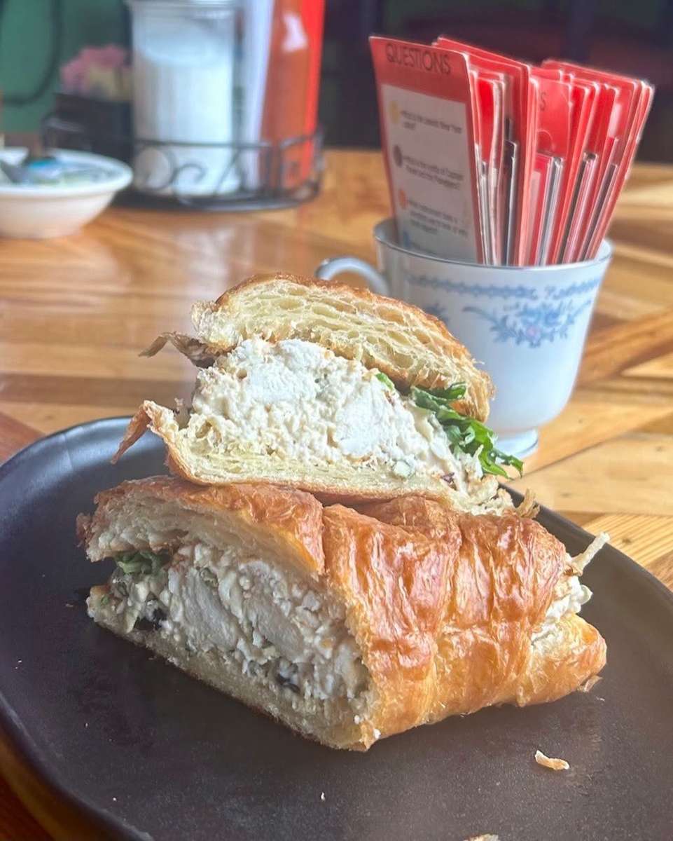Tahini based chicken salad with dried cranberries and pepitas served on a toasted croissant.