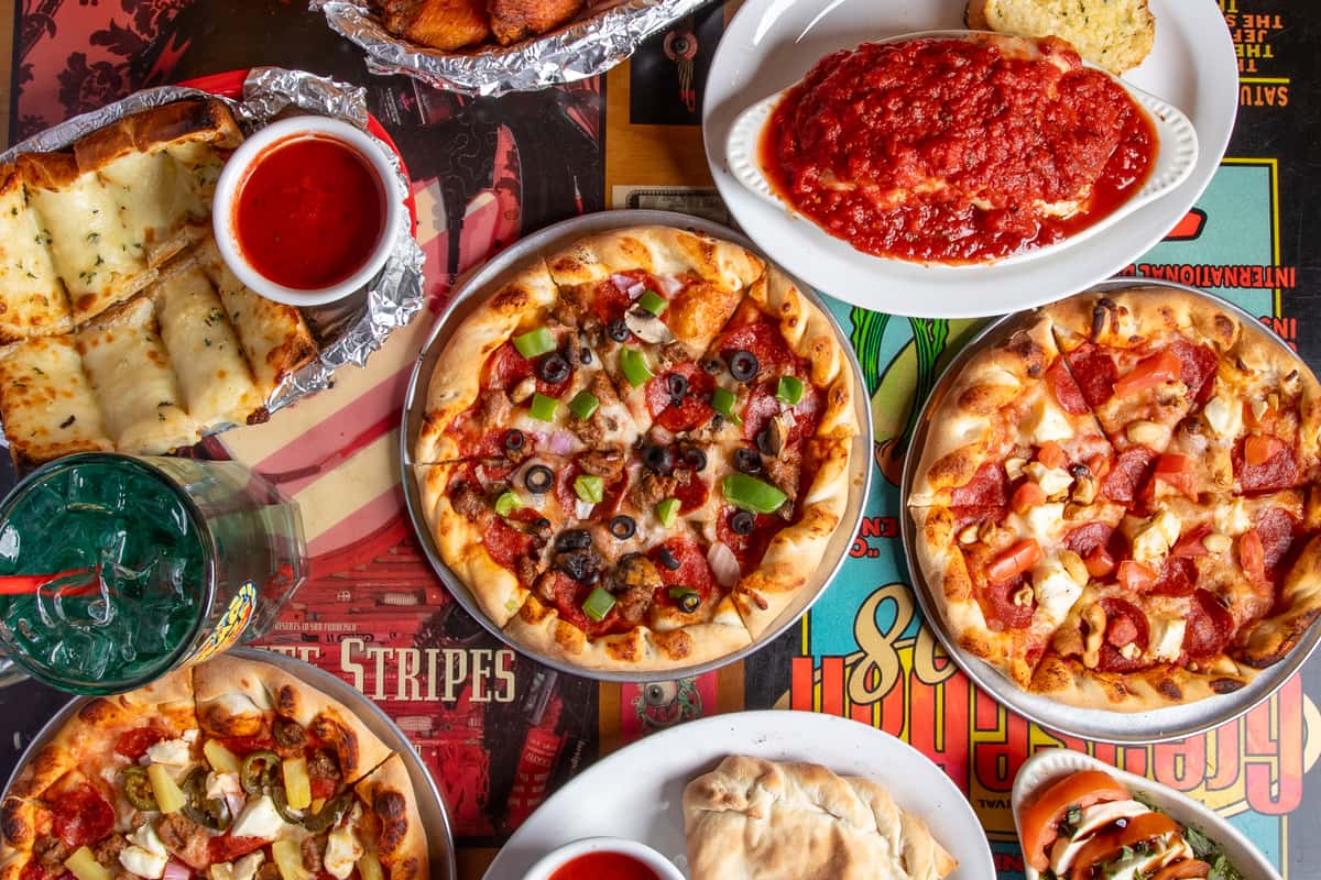 Hero shot of Pizzas and pasta