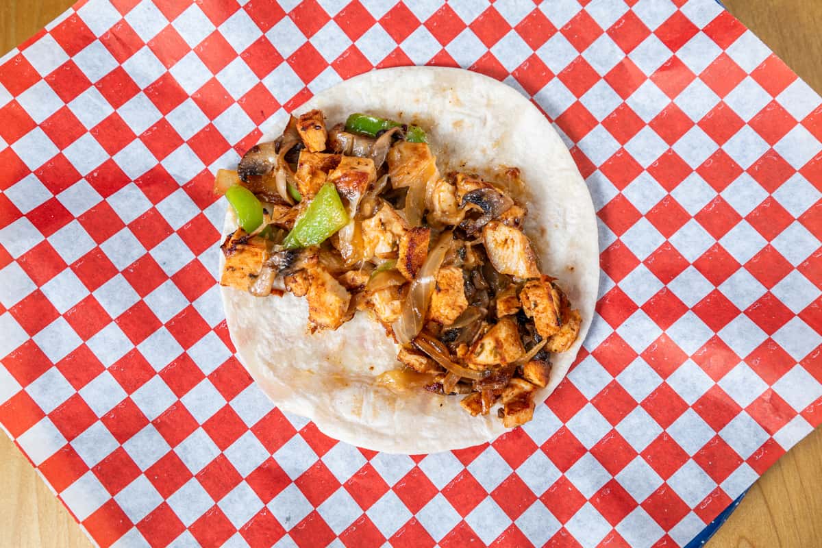 Top down view of Chicken Alambre on checkered paper