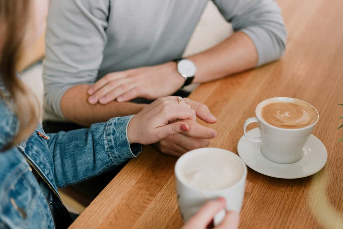 Two people drinking coffee together