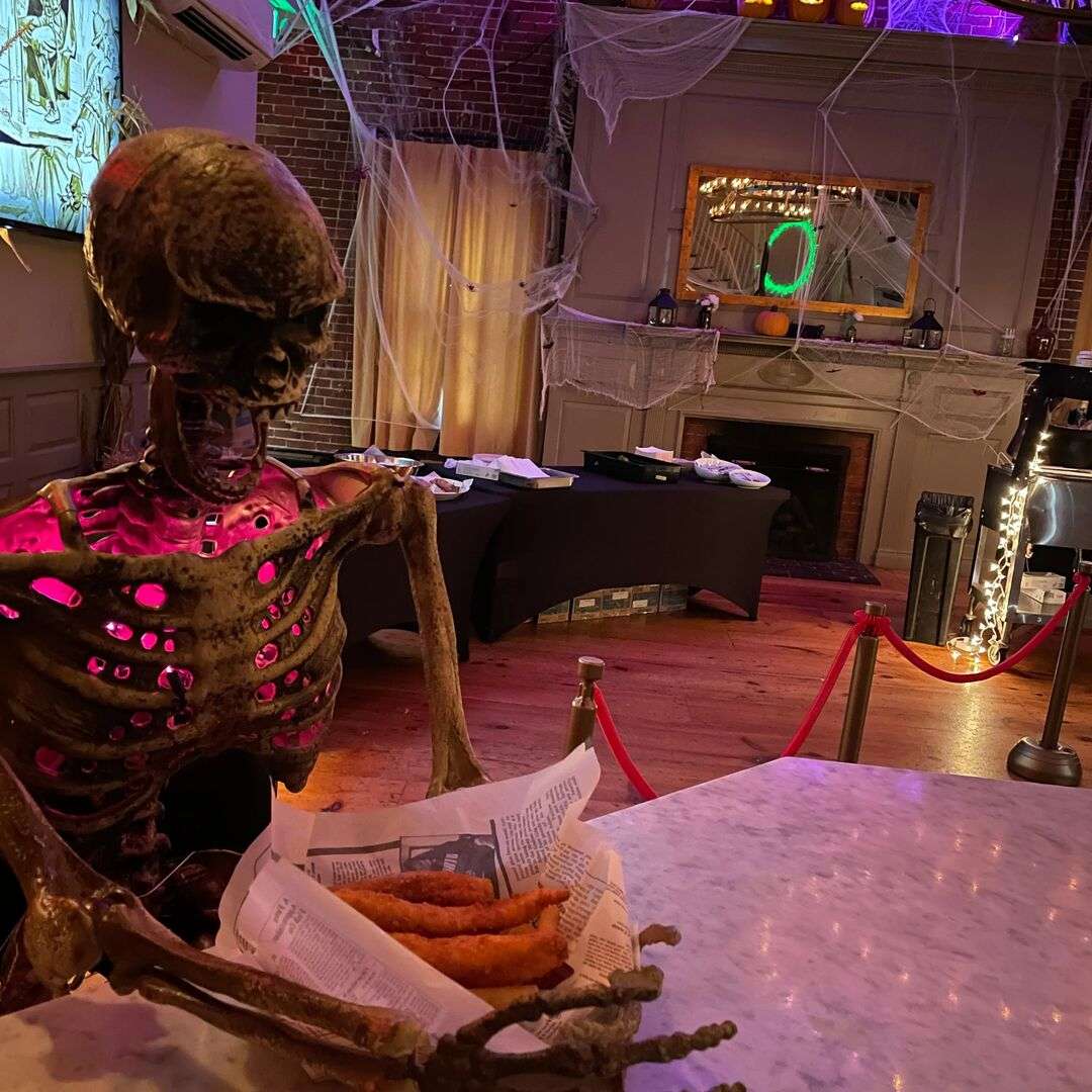 Human size skeleton at upstairs bar